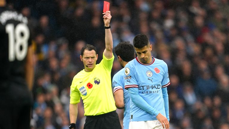 Joao Cancelo is shown a straight red card