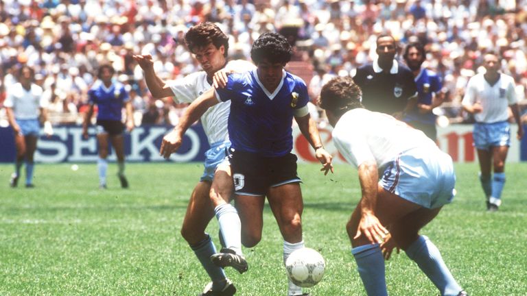 English defenders Terry Fenwick (left) and Kenny Sansom (right) try to stop Argentinian ace midfielder and goalgetter Diego Maradona. On the way to the title the Argentinian national team won their World Cup quarter final match against England in front of 114,600 spectators at the Aztec Stadium in Mexico City, Mexico on 22 June 1986by a final score of 2-1 with Maradona scoring both legendary goals for his team. Photo by: picture-alliance/dpa/AP Images