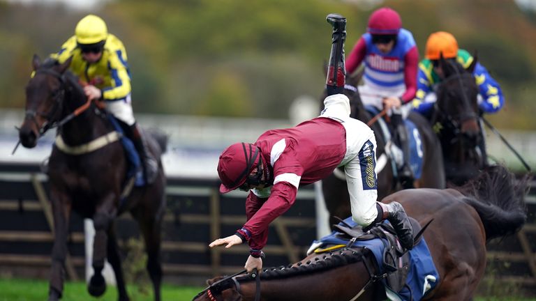 Sam Twiston-Davies suffers a dramatic fall from Master Chewy at Ascot.  The horse and rider were on their feet.