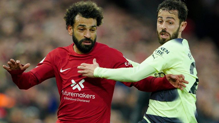 Liverpool's Mohamed Salah battles with Manchester City's Bernardo Silva during the Premier League match at Anfield, Liverpool. Picture date: Sunday October 16, 2022.