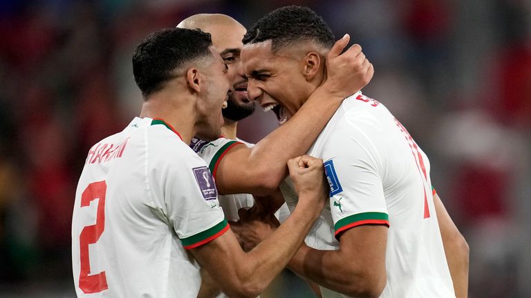 Morocco&#39;s Abdelhamid Sabiri, right, celebrates after scoring his side&#39;s opening goal with team mates Achraf Hakimi, left, and Sofyan Amrabat during the World Cup group F soccer match between Belgium and Morocco, at the Al Thumama Stadium in Doha, Qatar, Sunday, Nov. 27, 2022. (AP Photo/Christophe Ena)