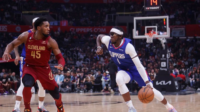 Los Angeles Clippers guard Reggie Jackson drives against Cleveland Cavaliers guard Donovan Mitchell during an NBA basketball game Monday, November 7, 2022, in Los Angeles. 