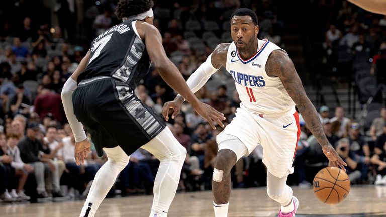 Los Angeles Clippers guard John Wall (11) drives against San Antonio Spurs guard Josh Richardson (7) during the second half of an NBA basketball game Friday, Nov. 4, 2022, in San Antonio. (AP Photo/Nick Wagner)


