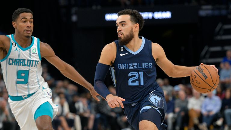 Memphis Grizzlies guard Tyus Jones (21) drives against Charlotte Hornets guard Theo Maledon (9) during the second half of an NBA basketball game Friday, Nov. 4, 2022, in Memphis, Tenn. (AP Photo/Brandon Dill)


