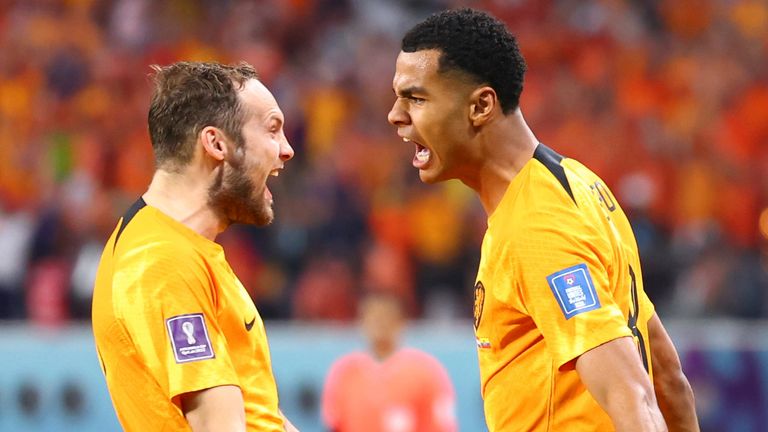 Cody Gakpo celebrates with team-mate Daley Blind