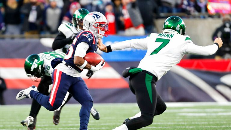 New England Patriots returner Marcus Jones (25) evades New York Jets punter Braden Mann (7) to return a punt for a touchdown during the second half of an NFL football game, Sunday, Nov. 20, 2022, in Foxborough, Mass. (AP Photo/Greg M. Cooper)