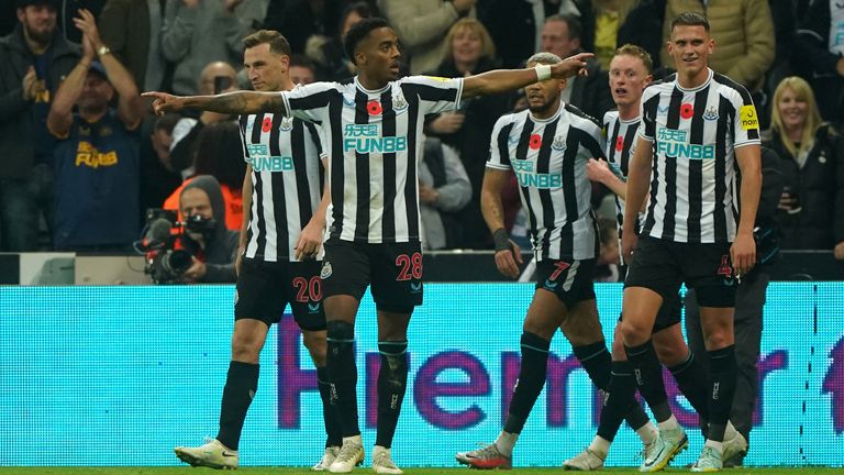 Newcastle United's Joe Willock (front left) celebrates scoring their side's first goal of the game during the Premier League match at St James' Park, Newcastle. Picture date: Saturday November 12, 2022.