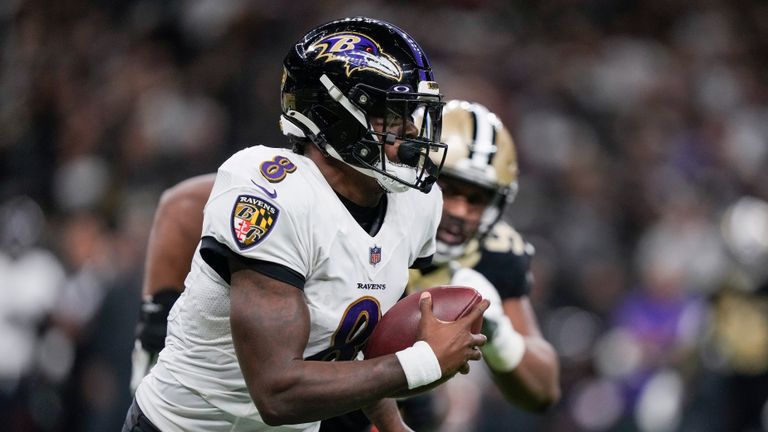 Baltimore Ravens quarterback Lamar Jackson scrambles away from the New Orleans Saints defense in the second half of an NFL football game in New Orleans, Monday, Nov. 7, 2022.