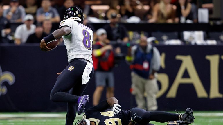 Baltimore Ravens quarterback Lamar Jackson runs over New Orleans Saints defensive end Cameron Jordan during an NFL football game, Monday, Nov. 7, 2022, in New Orleans.