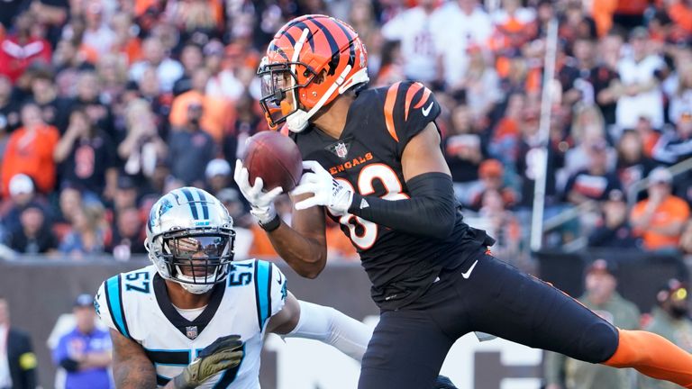 Cincinnati Bengals wide receiver Tyler Boyd (83) makes a catch in front of Carolina Panthers linebacker Damien Wilson (57) during the second half of an NFL football game, Sunday, Nov. 6, 2022, in Cincinnati. (AP Photo/Joshua A. Bickel)



