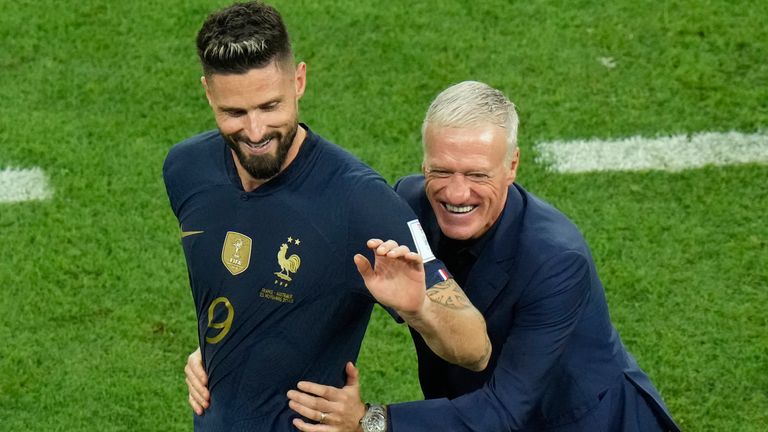 Olivier Giroud is congratulated by France coach Didier Deschamps