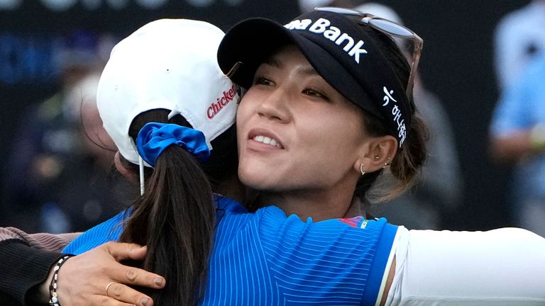 Lydia Ko, of New Zealand, right, hugs Pajaree Anannarukarn, of Thailand, left, after the second round of the LPGA CME Group Tour Championship golf tournament, Friday, Nov. 18, 2022, at the Tibur..n Golf Club in Naples, Fla. (AP Photo/Lynne Sladky)