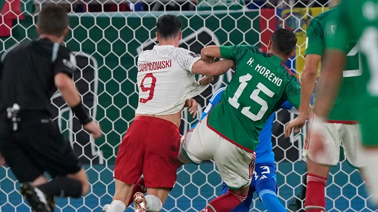 Hector Moreno tangles with Robert Lewandowski, conceding a penalty awarded via VAR