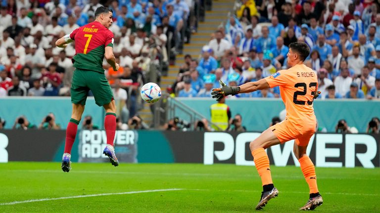 Cristiano Ronaldo tries to watch Bruno Fernandes' cross into the net