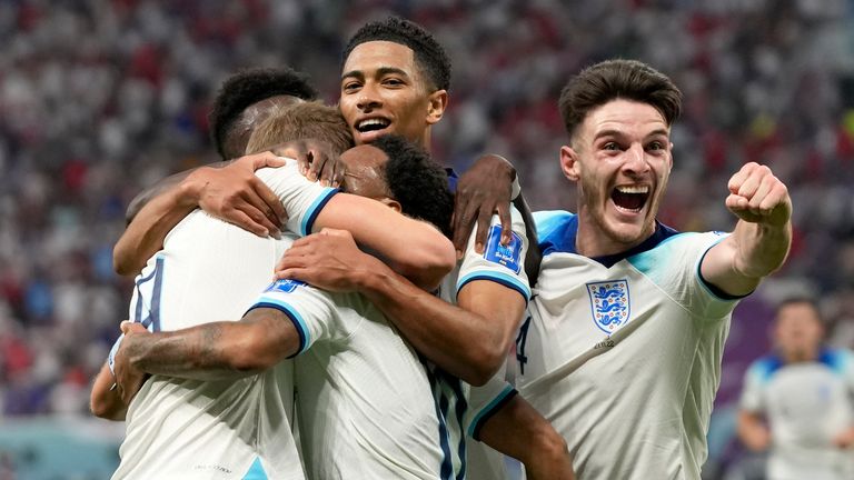 England's Raheem Sterling celebrates with team mates after scoring his side's third goal