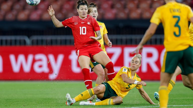 Rhiannon Roberts puts in a tackle for Wales against Switzerland