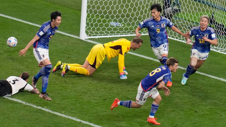Japan&#39;s Ritsu Doan (bottom right) celebrates after scoring his side&#39;s first goal