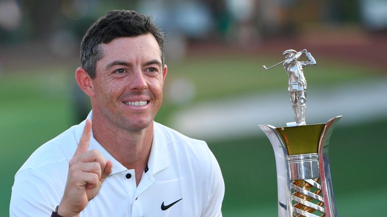Rory McIlroy of Northern Ireland is posing with the trophy for his fourth win of the DP World Tour season after finishing fourth in DP World Tour Championship in Dubai, United Arab Emirates, Sunday, Nov. 20, 2022. (AP Photo/Martin Dokoupil)