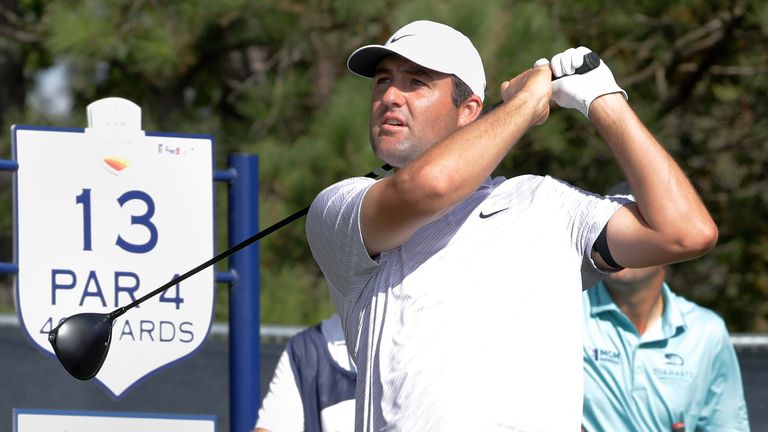 Scottie Scheffler watches his tee shot on the 13th hole during the first round of the Houston Open golf tournament