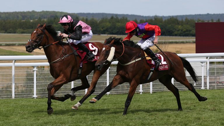 Sir Chauvelin and Robert Winston lead Melting Dew and Ryan Moore home to win The Qatar Summer Handicap Stakes at the Goodwood Festival