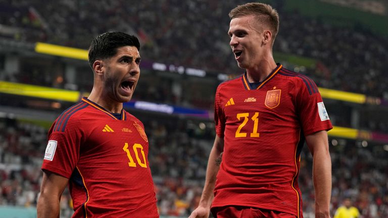 Goalscorers Marco Asensio and Dani Olmo celebrate after Spain&#39;s second goal against Costa Rica