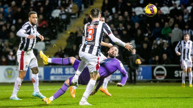  Clark scores an overhead kick in the last minute