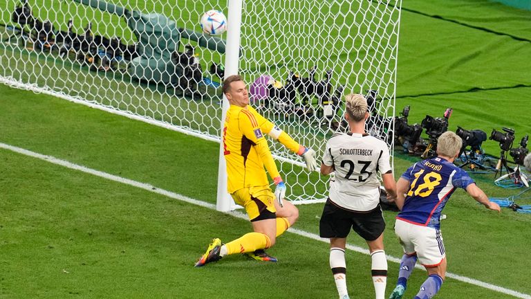 Takuma Asano right scores Japan&#39;s second goal of the game