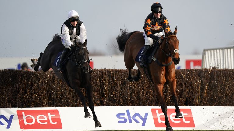 Third Time Lucki ridden by Harry Skelton (left) jumps a fence before going on to win the Watch Off The Fence On attheraces.com Lightning Novices' Chase at Doncaster Racecourse.