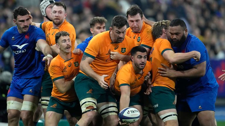 Australia's Tom Wright reaches out to pass the ball from a maul during the Autumn Nations Cup rugby union international match between France and Australia at the Stade de France, in Saint-Denis, near Paris, Saturday, Nov. 5, 2022. (AP Photo/Thibault Camus)