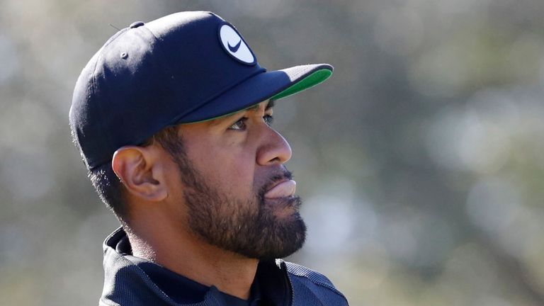 Tony Finau reacts as he watches his tee shot on the ninth hole during the third round of the Houston Open golf tournament, Saturday, Nov. 12, 2022, in Houston. (AP Photo/Michael Wyke)