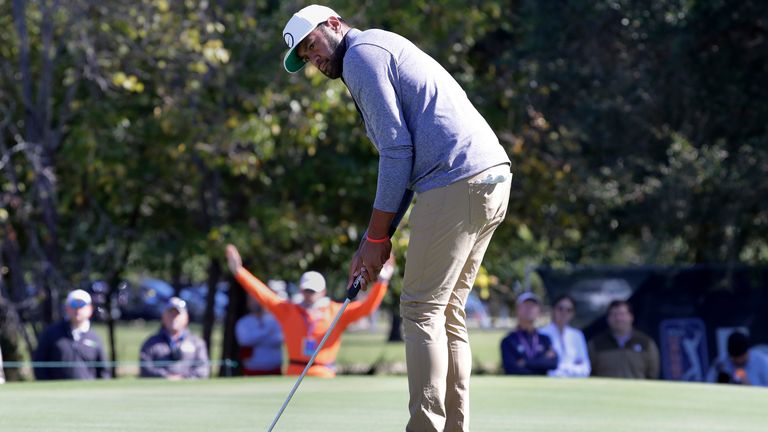 Tony Finau watches his putt on the ninth green for a birdie during the final round of the Houston Open golf tournament Sunday, Nov. 13, 2022, in Houston. (AP Photo/Michael Wyke)