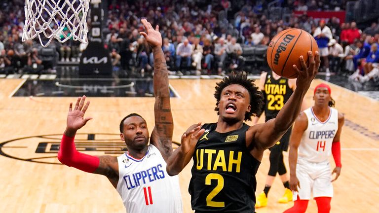 Utah Jazz guard Collin Sexton, right, shoots as Los Angeles Clippers guard John Wall defends during the second half of an NBA basketball game Sunday, Nov. 6, 2022, in Los Angeles. (AP Photo/Mark J. Terrill)