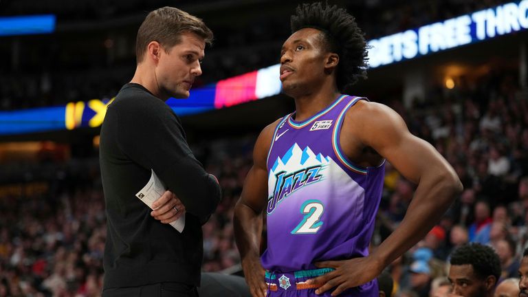 Utah Jazz head coach Will Hardy talks with guard Collin Sexton during a clash against the Denver Nuggets