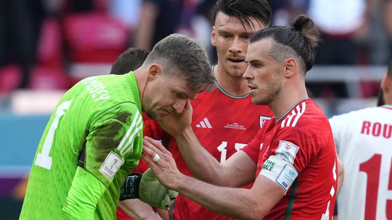 Wayne Hennessey is consoled by Gareth Bale after being sent off