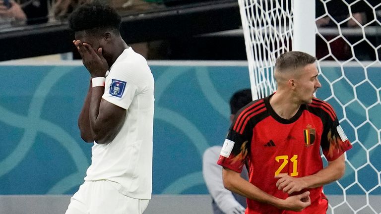 Alphonso Davies reacts after his penalty is saved by Thibaut Courtois