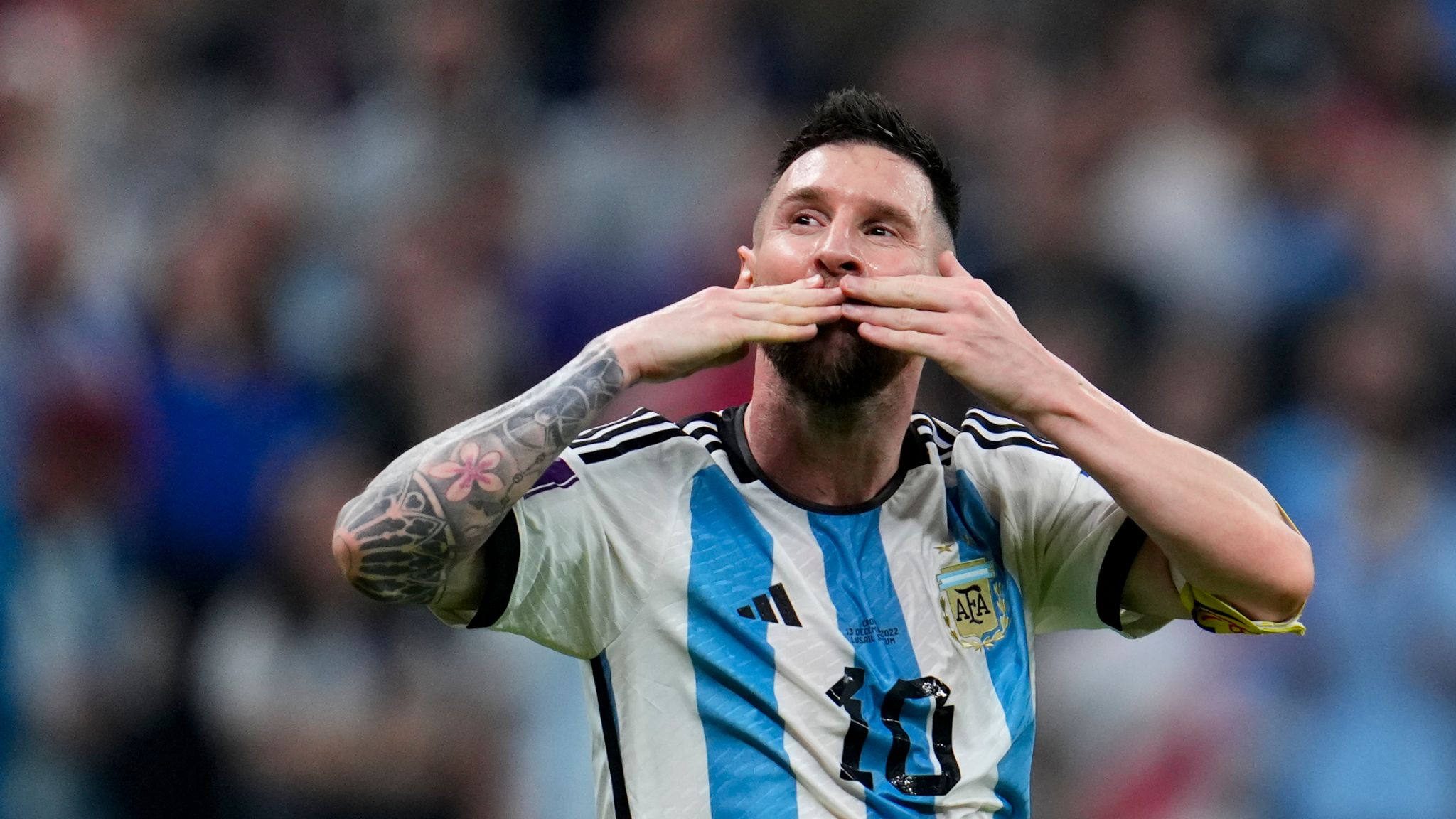Lionel Messi celebrates after team-mate Julian Alvarez scored Argentina's third goal
