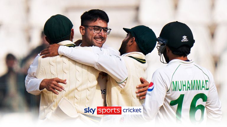 Pakistan&#39;s Abrar Ahmed, second left, is congratulated by teammates after he taking his fifth wicket