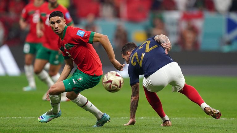 Morocco's Achraf Hakimi turns away from Theo Hernandez