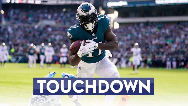 Philadelphia Eagles&#39; A.J. Brown scores a touchdown in front of Tennessee Titans&#39; Kristian Fulton
