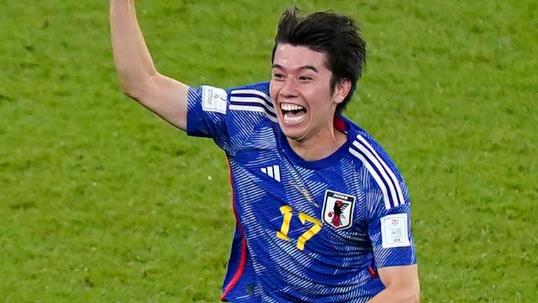 Japan's Ao Tanaka (left) celebrates scoring their side's second goal of the game