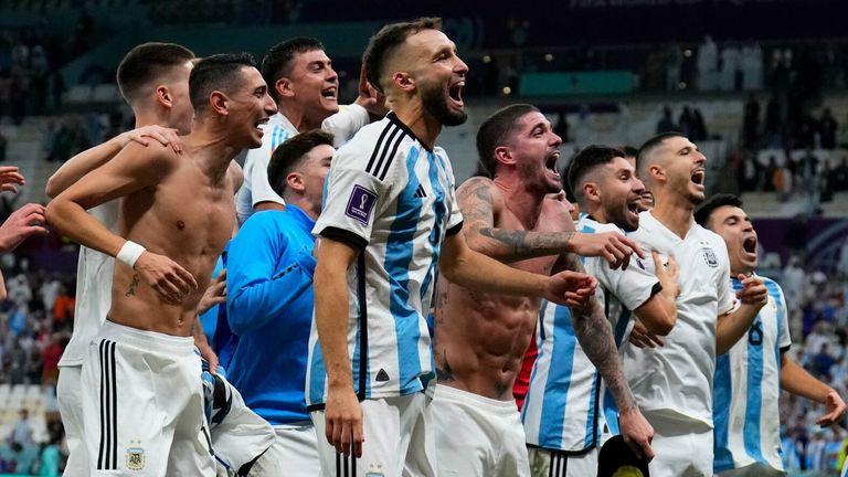 Argentina's players celebrate their victory in the penalty shootout over the Netherlands