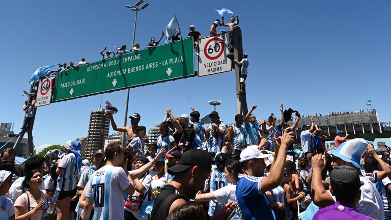 Argentina fans took up a number of vantage points for the intended bus parade through Buenos Aires...