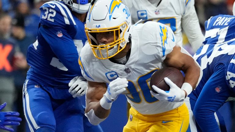 Los Angeles Chargers' Austin Ekeler (30) runs in for a touchdown during the first half of an NFL football game against the Indianapolis Colts, Monday, Dec. 26, 2022, in Indianapolis. (AP Photo/AJ Mast)