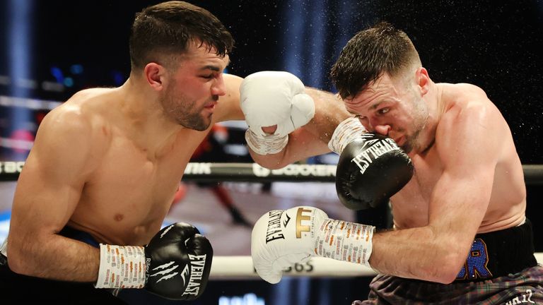 Jack Catterall throws a left into Josh Taylor at the OVO Hydro, Glasgow