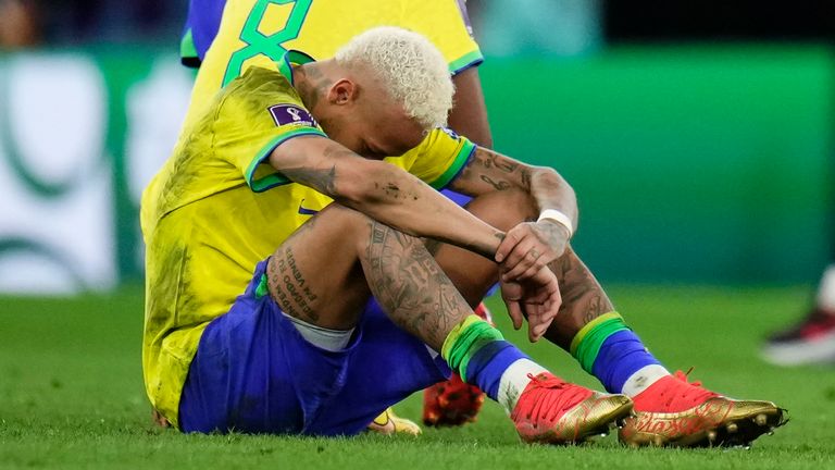 A forlorn Neymar sits on the pitch following Brazil&#39;s penalty shootout loss to Croatia