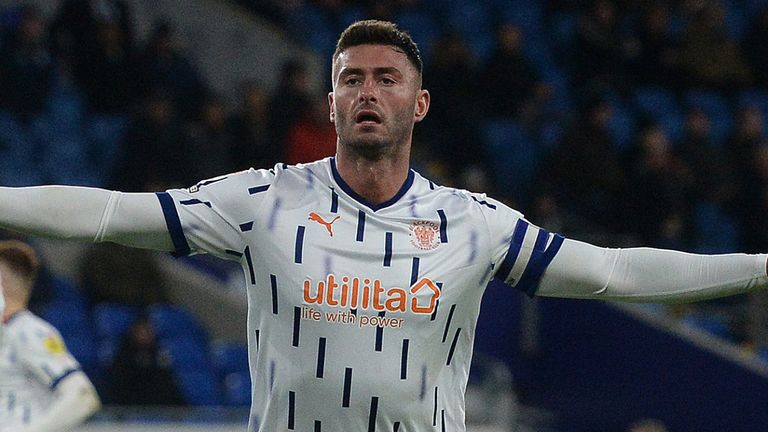 Gary Madine celebrates his equaliser for Blackpool at Cardiff