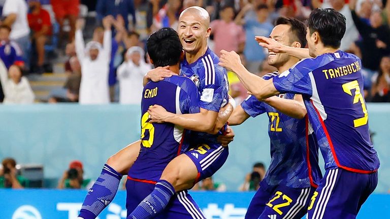 Daizen Maeda (2nd L) celebrates with team-mates after scoring Japan's opening goal