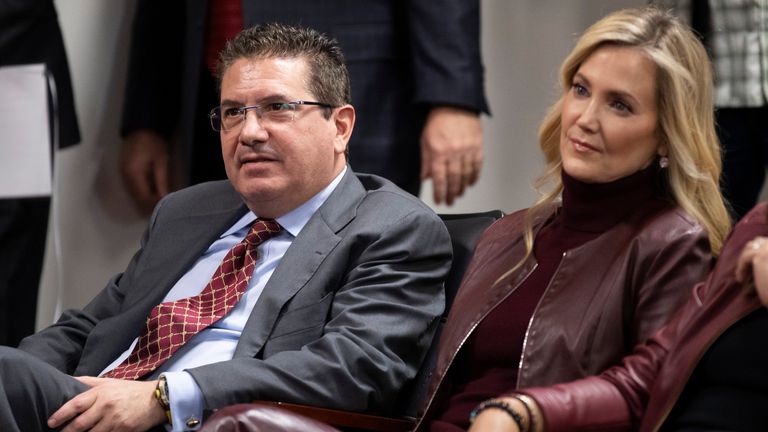 FILE - Washington Commanders owner Dan Snyder, left, and his wife Tanya Snyder, listen to head coach Ron Rivera during a news conference at the team's NFL football training facility in Ashburn, Va., in this Thursday, Jan. 2, 2020, file photo. Few NFL teams have managed to lose as much as Washington has since Daniel Snyder was part of a group that purchased the franchise for a then-record $800 million in 1999. (AP Photo/Alex Brandon, File)