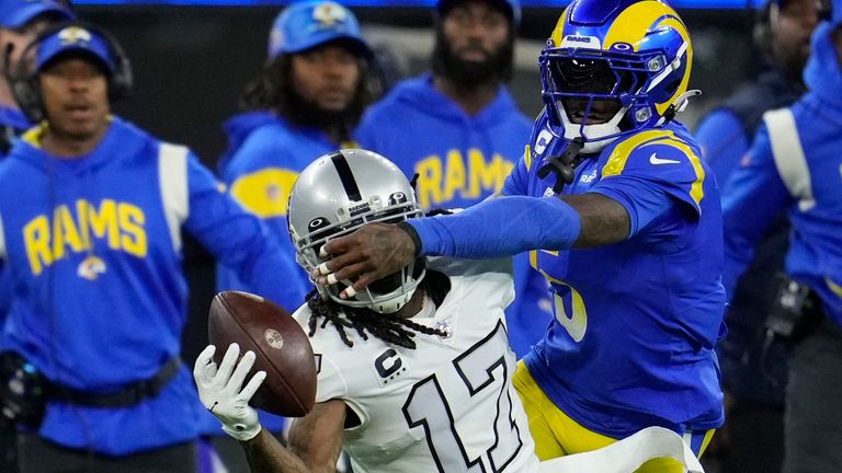 Las Vegas Raiders wide receiver Davante Adams (17) makes a one-handed catch as Los Angeles Rams cornerback Jalen Ramsey defends during the first half of an NFL football game Thursday, Dec. 8, 2022, in Inglewood, Calif. (AP Photo/Marcio Jose Sanchez)