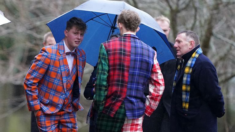 Doddie Weir's sons Ben (left) and Hamish talk to former Scotland international Gary Armstrong (right) 